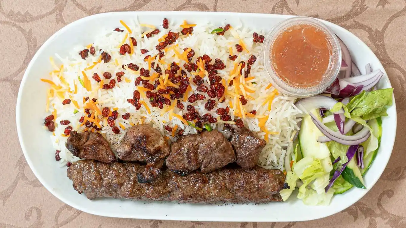 Lamb Shank With Rice And Salad at Kabul Restaurant in Calgary, AB